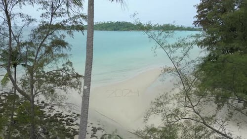 2024 Written on a Tropical Beach Concept of a Beach Getaway in 2024
