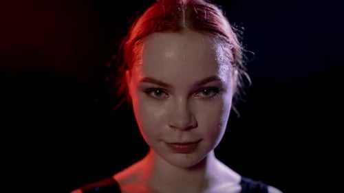 Closeup of Face of Selfconfident Young Woman Looking at Camera in Dark Studio Professional Ballet