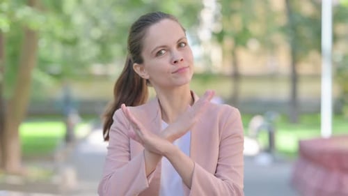 Rejecting Gesture by Tense Casual Business Woman Outdoor