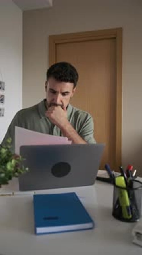 Focused Entrepreneur Reviewing Documents in Slow Motion