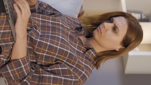 Woman Lying Down Typing on Laptop