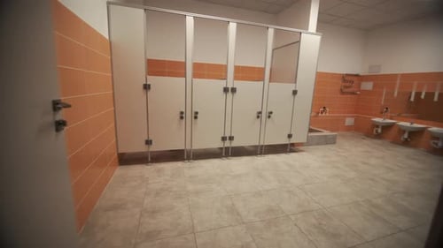Interior of Public Toilet with Stalls in Private School