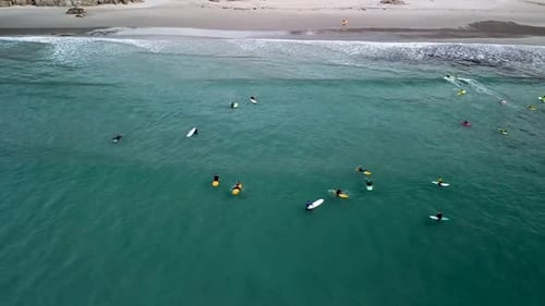 Surfing - Surfers Riding Waves In The Beach with Clear Water. - aerial