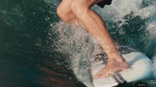 Surfer Barefoot Riding Ocean Wave, Close Up