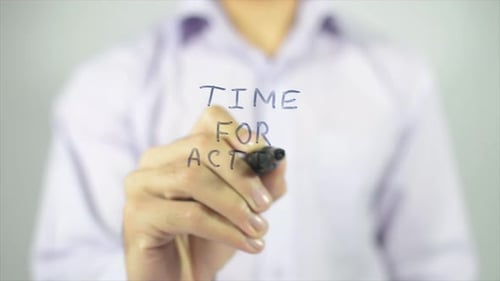 Man Writes Time For Action With Marker