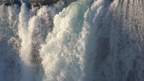 Majestic Goðafoss Waterfall in Winter, Adorned with Snow and Ice