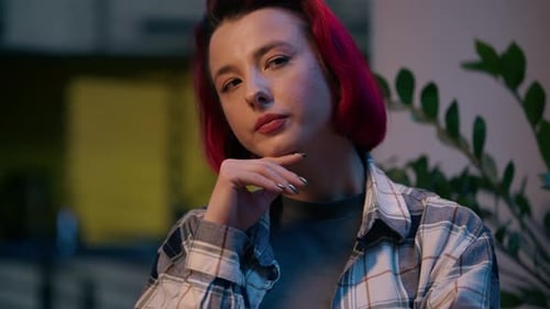 Young Woman Resting Hand on Face, Pondering