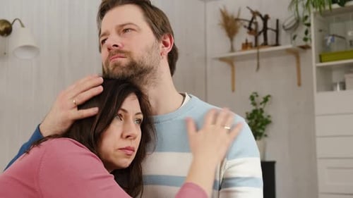 Couple Embracing in a Bright Home Interior