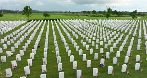 Sarasota National Cemetery with Many White Tombstones on Green Grass Lawn Memorial Day Concept