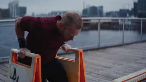 Man Exercising Dips in Urban Setting