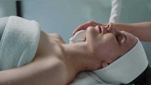 Nice Young Woman Having Lifting Procedure in Beauty Salon Experienced Cosmetologist Working with