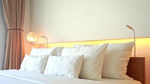 Modern Bedroom Interior with White Bed and Pillows