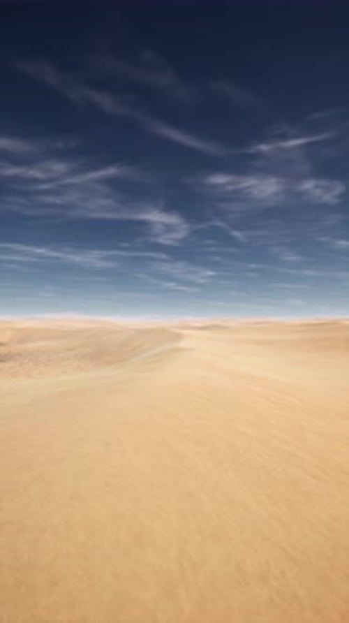 Arid Desert Landscape With Blue Sky and White Clouds