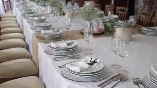 Elegant Wedding Reception Table Setting With Floral Decorations