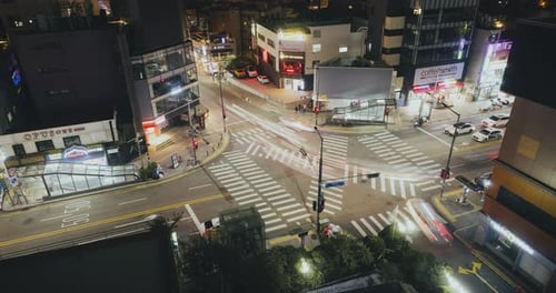 Night Time City Intersection Aerial Cars and Pedestrians