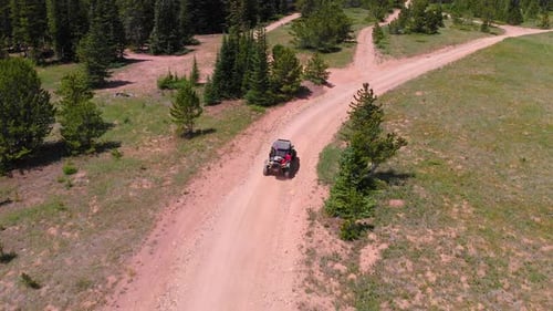 Drone follows SXS down the trail.