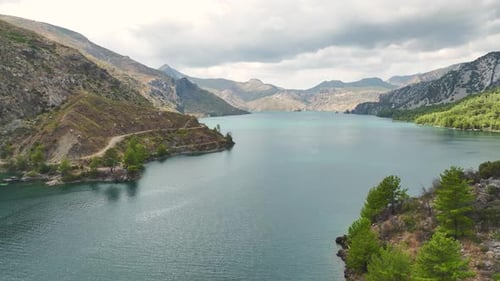 Aerial View Group Paddleboarding Adventure Through a Beautiful Green Canyon
