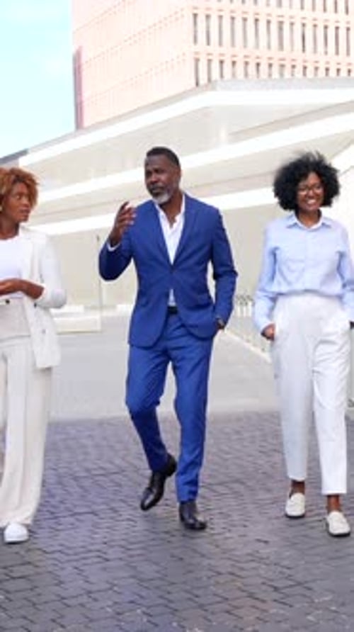 Multi-ethnic business people walking along the financial district