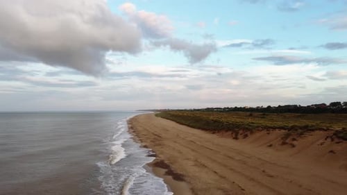 Drone view of the ocean beach from the sky. empty ocean beach with ocean wave tides.