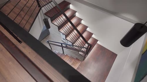 Top-down view of modern spiral staircase in urban building
