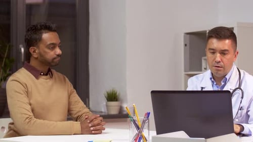 Doctor and hispanic patient discussing healthcare technology at hospital after visit