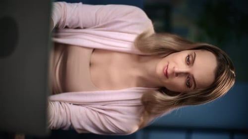 Woman Working on Laptop at Night at Home