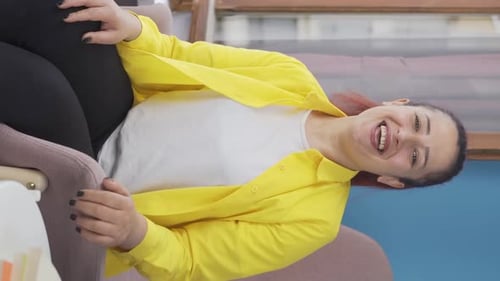 Woman Smiling, Clapping Hands, and Giving Thumbs Up