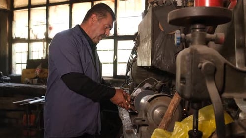 Man Working with Industrial Machinery