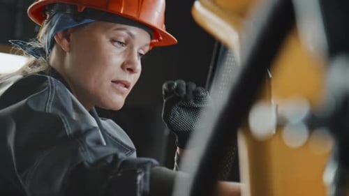 Female Mechanic Working Hard at Machine Equipment Producing Plant