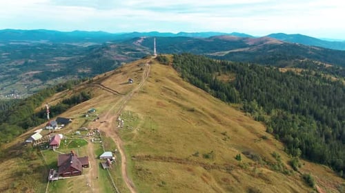 Aerial View of Mountain Peak on Cloudy Morning Outdoors Wide Shot Yellow Hill and Green Carpathian