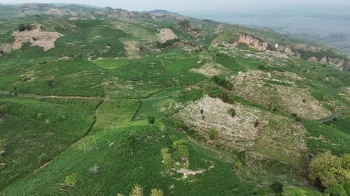 Aerial view of green rock hill landscape