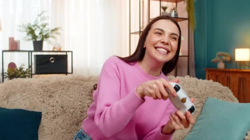 Woman Enjoying Video Game at Home