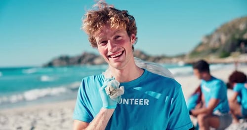 Volunteer, man and face for cleaning at beach with plastic bag, waste management