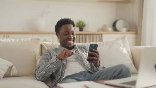 Man Video Calling From Couch At Home