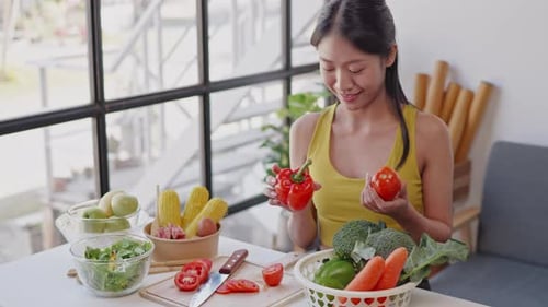 Woman Preparing Vegetables in Sunny Kitchen
