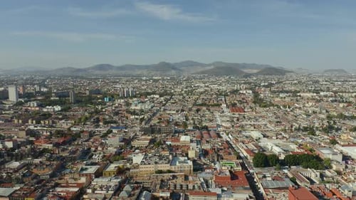 Mexico City Seen From Above with Mountains in Background on Beautiful Day