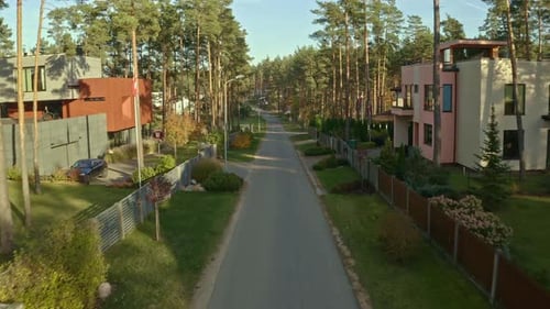 Modern countryside homes in the forest - aerial flyover
