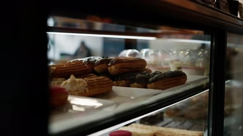 Counter full of delicious buns and pastries in a shop, bakery