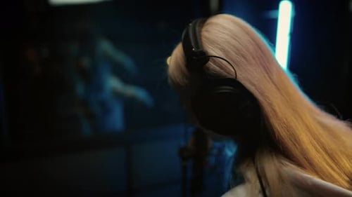 Popular Talented Woman Singer Recording New Track in Musical Studio Rear View Professional Singer or