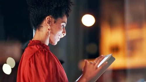 Tablet, night and happy black woman typing, planning and online management application in office