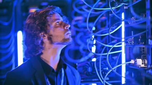 Man analysing servers in a data center