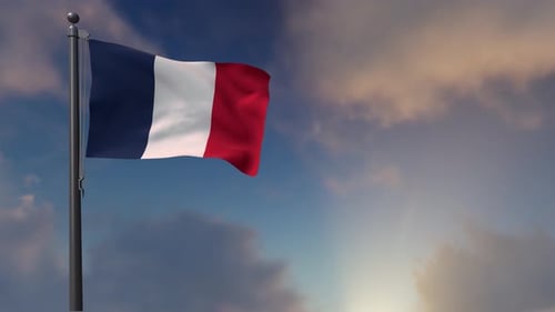 French Flag Waving Against a Cloudy Blue Sky
