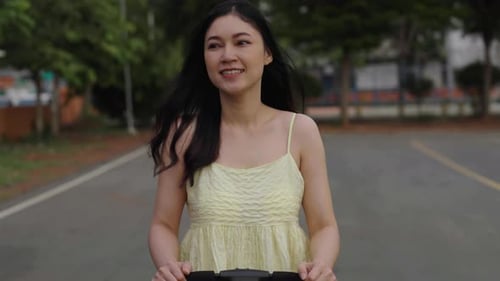 happy mother pushing infant baby stroller and walking in the park