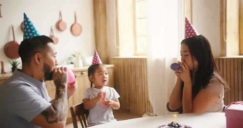 Family Celebrating Birthday Together at Home