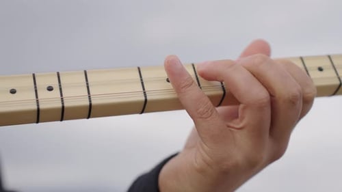 Playing traditional Turkish musical instrument Baglama, Saz