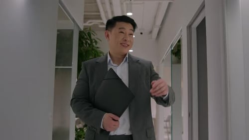 Happy Asian Middleaged Businessman Man Walking in Office Hallway Go to Business Meeting Hold Folder