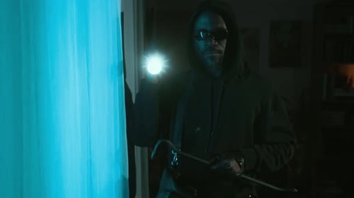 Man with Crowbar and Flashlight in Dark Home