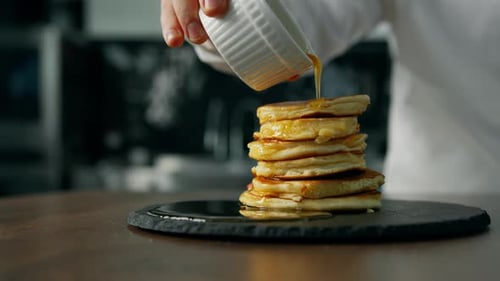 Pancakes close-up. Honey flows on pancakes
