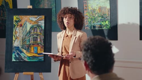 Woman Presenting Modern Art in Urban Gallery