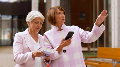 Tourism, Travel and Friendship Concept - Happy Senior Women with City Guide